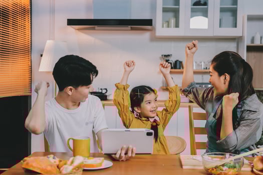 Family celebrating in a cozy kitchen photo