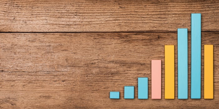 Simple bar chart showing growth trends on wooden background photo