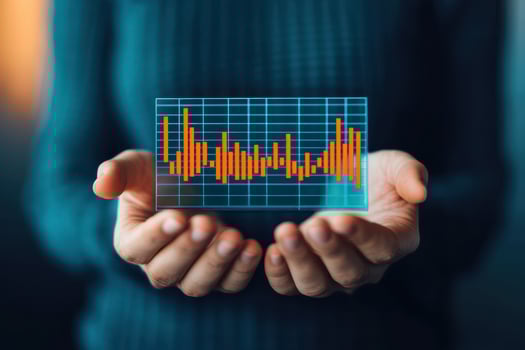 Hands holding chart showing dividend payout trends photo