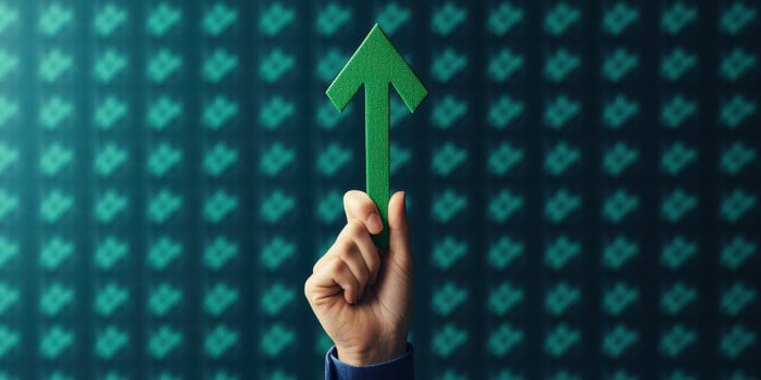 Hand holding green arrow upward success growth chart data photo