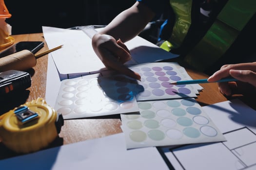 Hands selecting colorful stickers on table photo