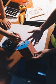 Hands working on a project together photo