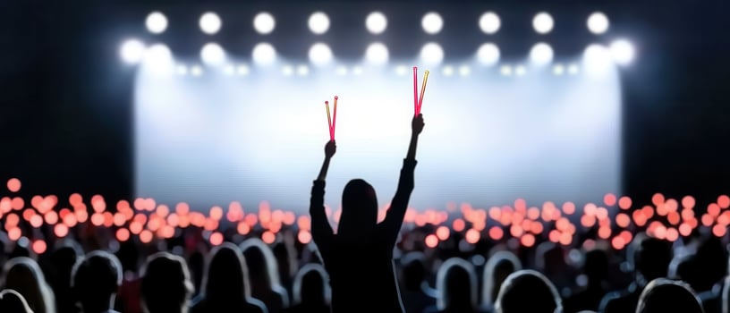 Concert crowd silhouette with raised arms at music performance photo