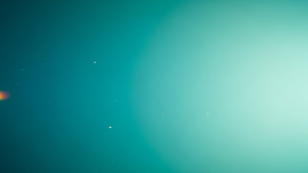 A bright green light is shining in the sky photo