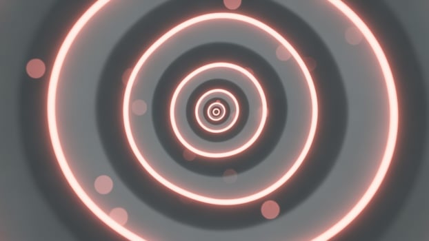 A circular pattern of lights and circles in pink photo