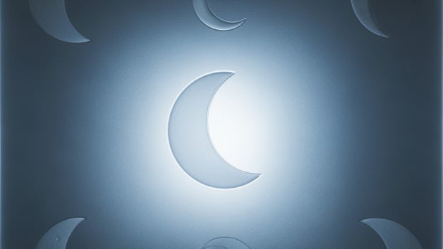 A blue moon with a crescent moon in the center photo