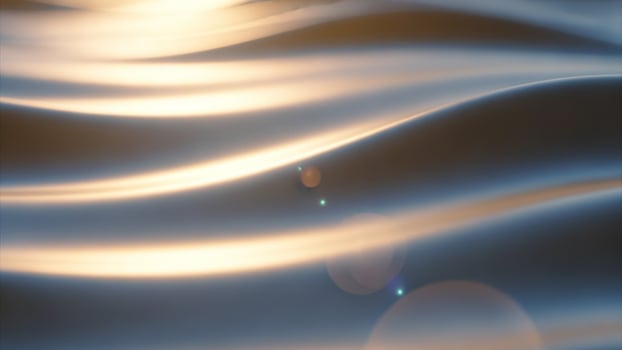A photo of a wave with a light shining on it