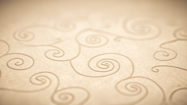 A close up of a paper with swirls on it photo