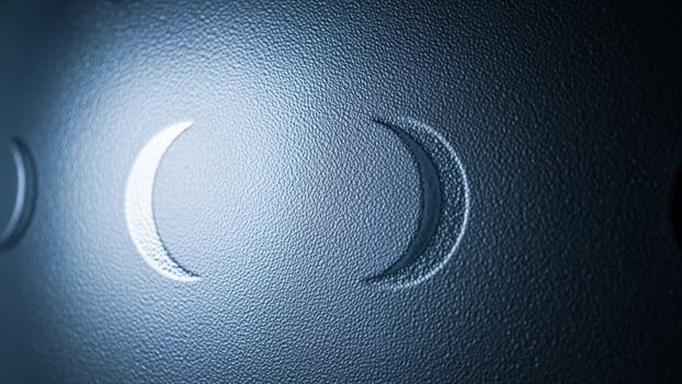 A close up of a moon with three phases photo