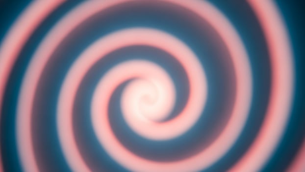 A spiral is shown in a dark background photo