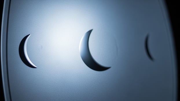 The moon is shown in the dark with three phases photo