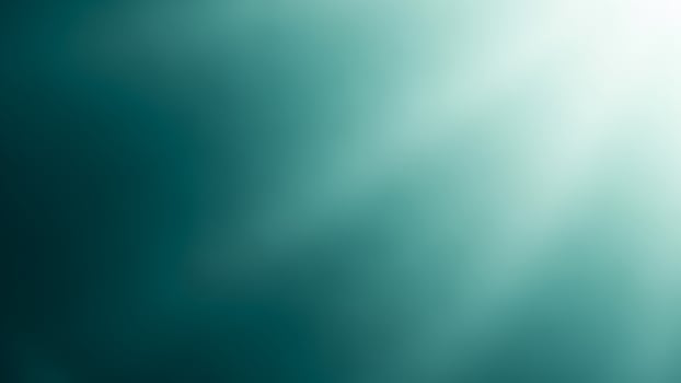 A green light shining through a dark background photo