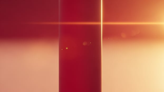 A red pole with a sun shining through it photo