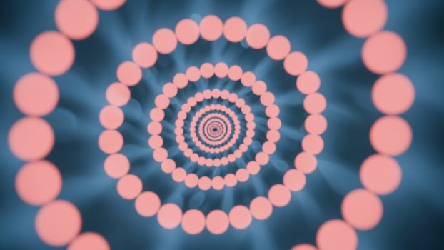 A circular pattern of dots is shown in a blue and pink background photo