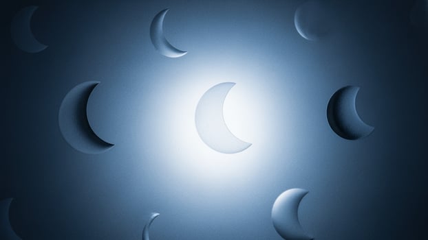 A blue background with many moon shaped objects photo