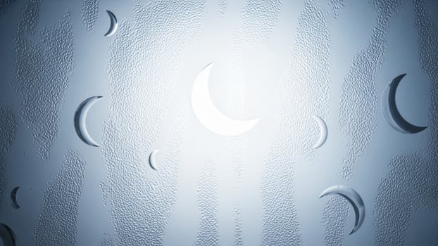 A blue background with a moon and stars photo