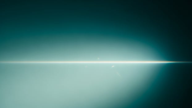 A light beam is shining through the dark sky photo