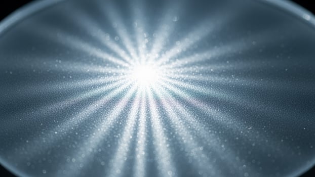 A bright light shining through a glass lens photo