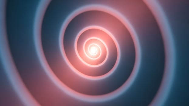 A red and blue spiral with a bright light photo