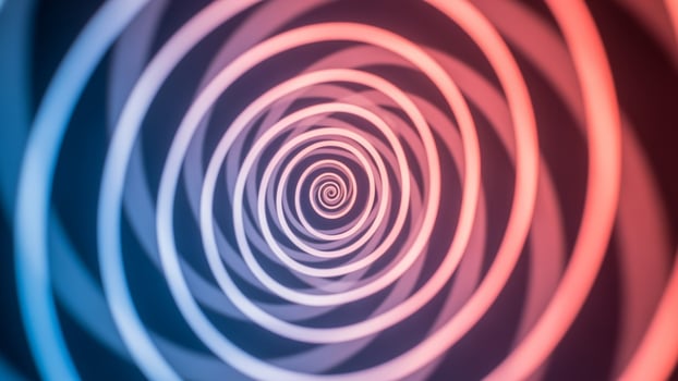 A red and blue spiral with a blue light photo