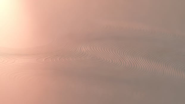 A wave pattern on a surface with a pink background photo