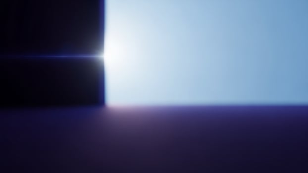 A blue light shines through a door photo