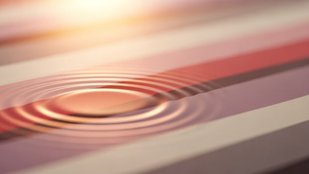 A circular object with a ripple on it photo