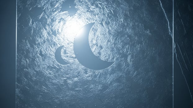 A blue and white image of a crescent moon photo