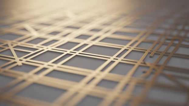 A close up of a metal grid with a golden color photo
