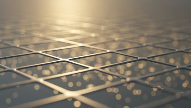 A grid of squares with lights shining through them photo