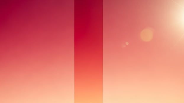 A red and orange striped flag with the sun in the background photo