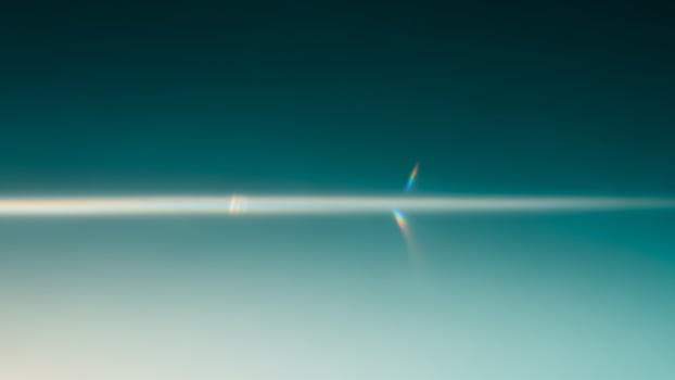 A long line of light coming from the sun photo