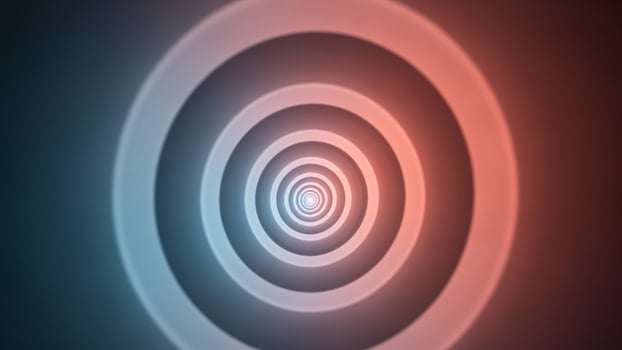 A circular red and blue spiral in the center of the image photo
