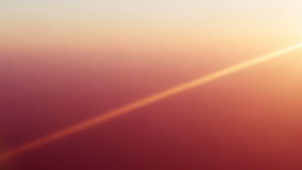 A plane flying over the sun with the sun shining photo