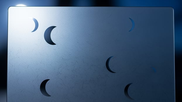 A metal plate with a moon on it photo