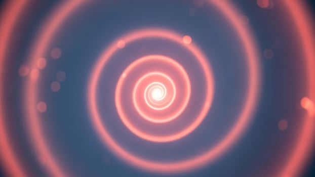 A red spiral is shown in the center of a dark blue background photo