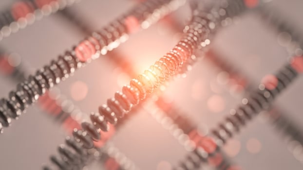 A close up of a metal mesh with a red light photo