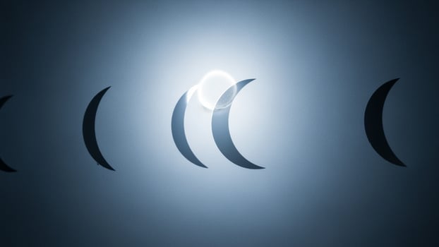 A group of three crescent shaped lights are shown photo