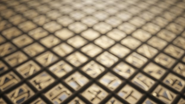 A close up of a metal grid with a pattern photo