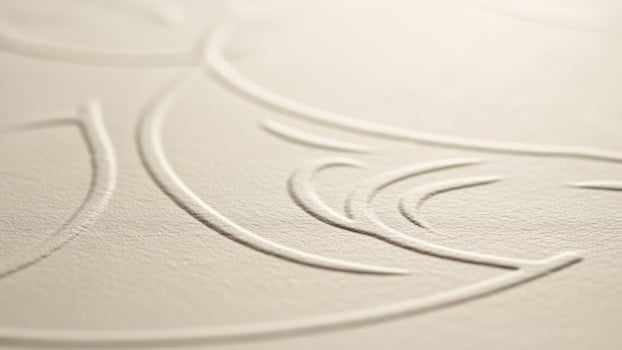 A close up of a white pattern on a white surface photo