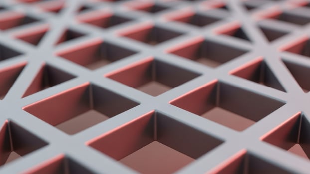 A close up of a metal grid with red and gray squares photo