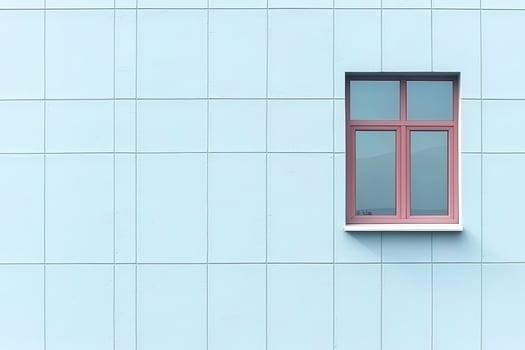 Minimalist light blue wall with single red window casting soft shadow, creating calm mood photo