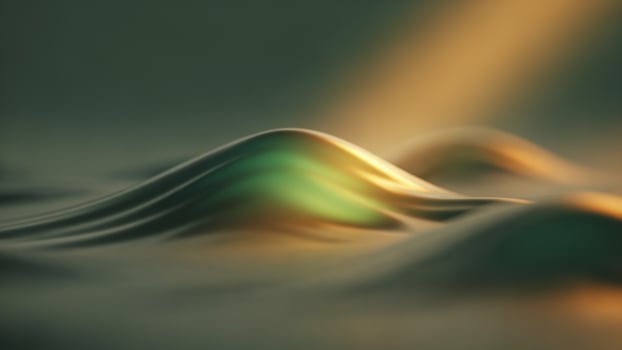 A wave of water with a green light shining on it photo