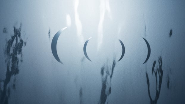 A blue and white photo of a person standing in front of a mirror