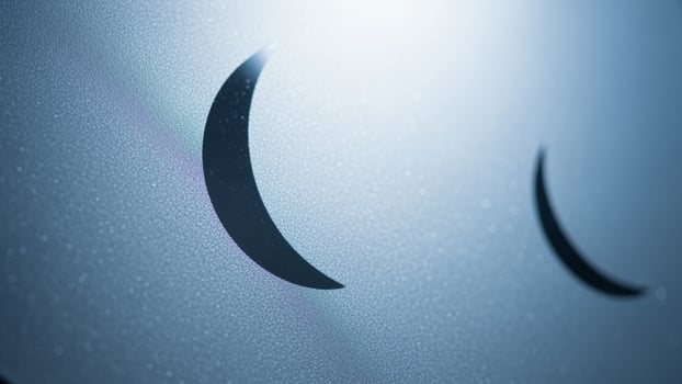A close up of a crescent moon on a window photo