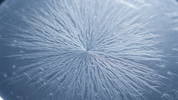 A close up of a snowflake on a glass surface photo