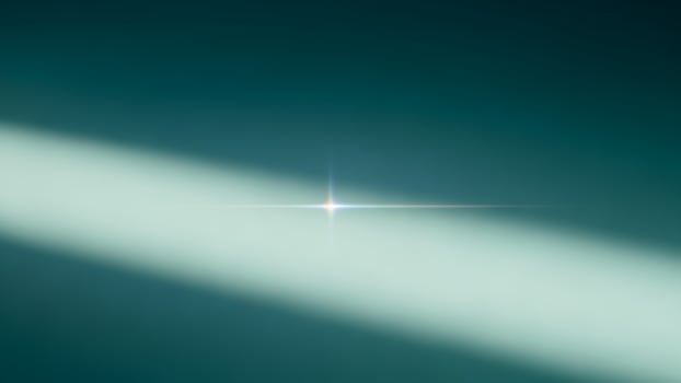 A bright light shining on a dark background photo