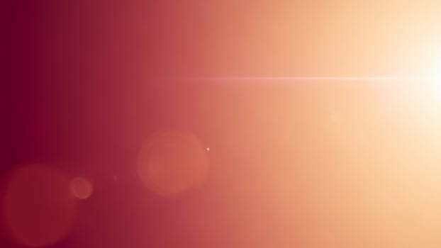 Sunlight shining through a red and orange background photo