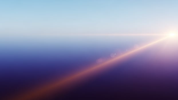Sunlight shining through a blue sky and fog photo