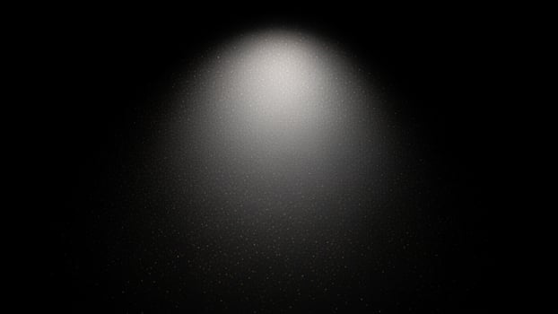 A light beam is shining through a dark room photo